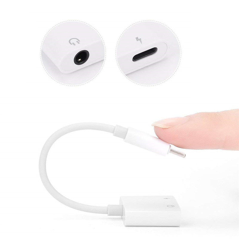 8-in-1 phone audio adapter connected to smartphone, allowing charging and audio playback simultaneously.
