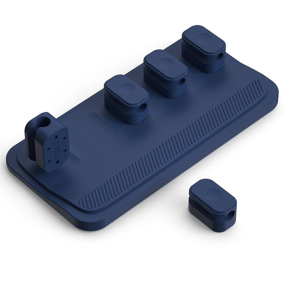 bfe4Charging cable wire holder with multiple ports for organized cable management on a desktop.a3583c75936a7ae2e0c103390698