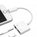 8-in-1 phone audio adapter connected to smartphone, allowing charging and audio playback simultaneously.